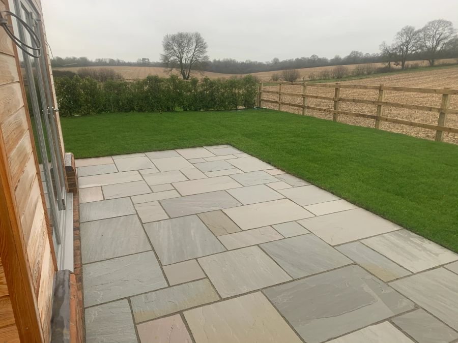 Paved patio beside a lawn