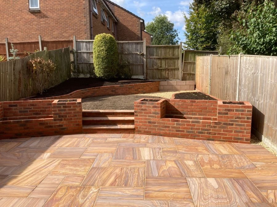 Brick raised beds and paved patio